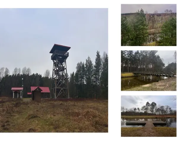Wieża widokowa i małe budynki z czerwonymi dachami na tle lasu. W oddali widać fragmenty krajobrazu, mostek nad wodą i pomost. To miejsce przypomina akwedukt w Fojutowie.